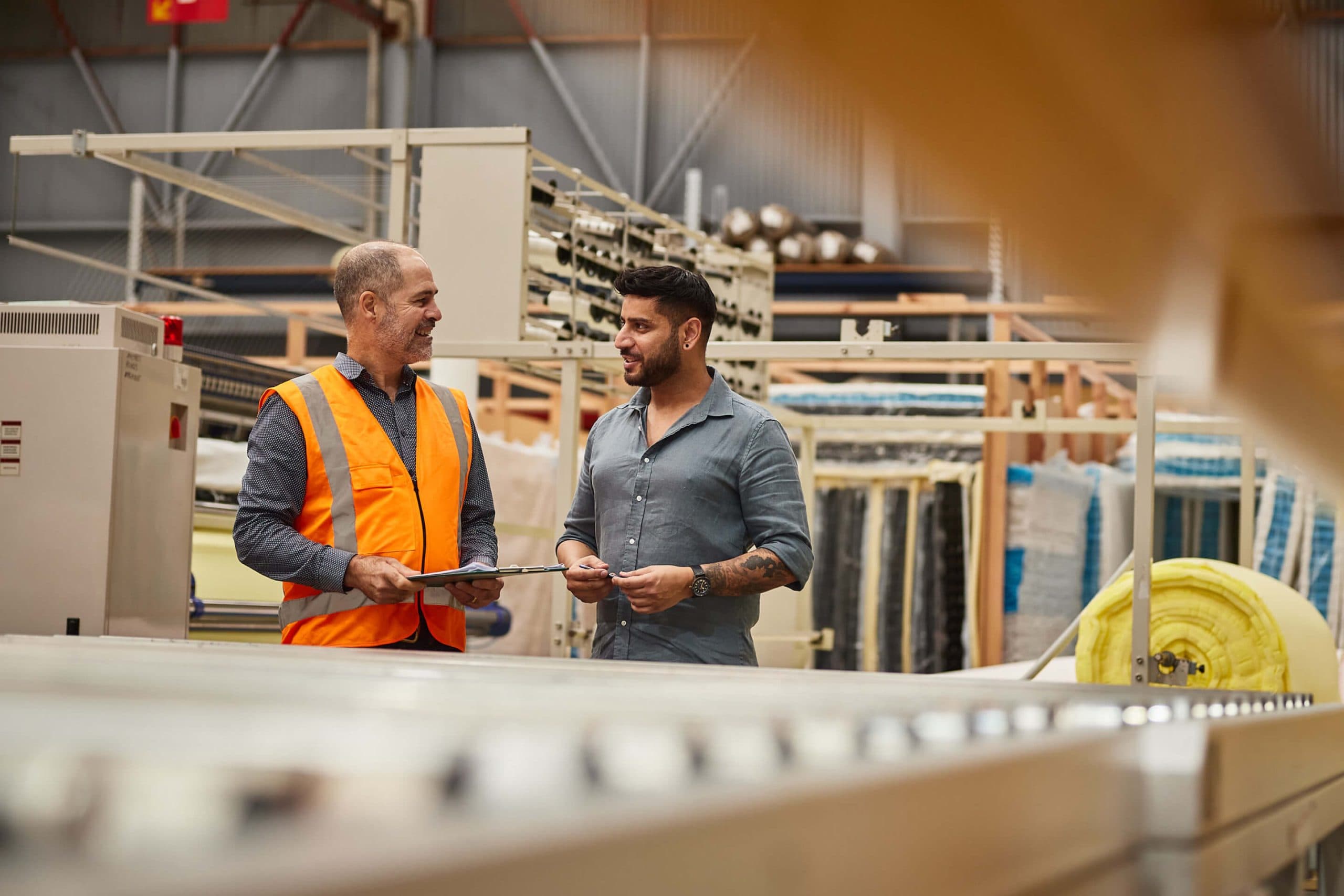 Two men talking on the warehouse production line